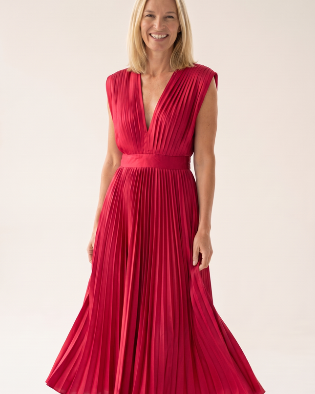 Woman wearing pleated satin midi dress