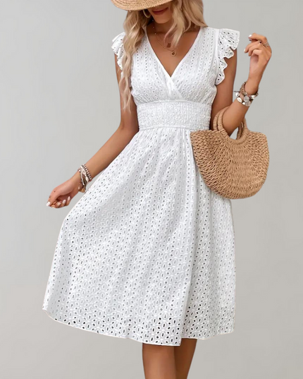 Woman wearing broderie v-neck summer dress