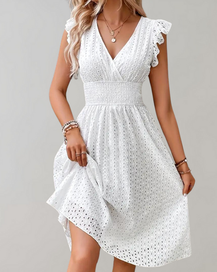 Woman wearing broderie v-neck summer dress