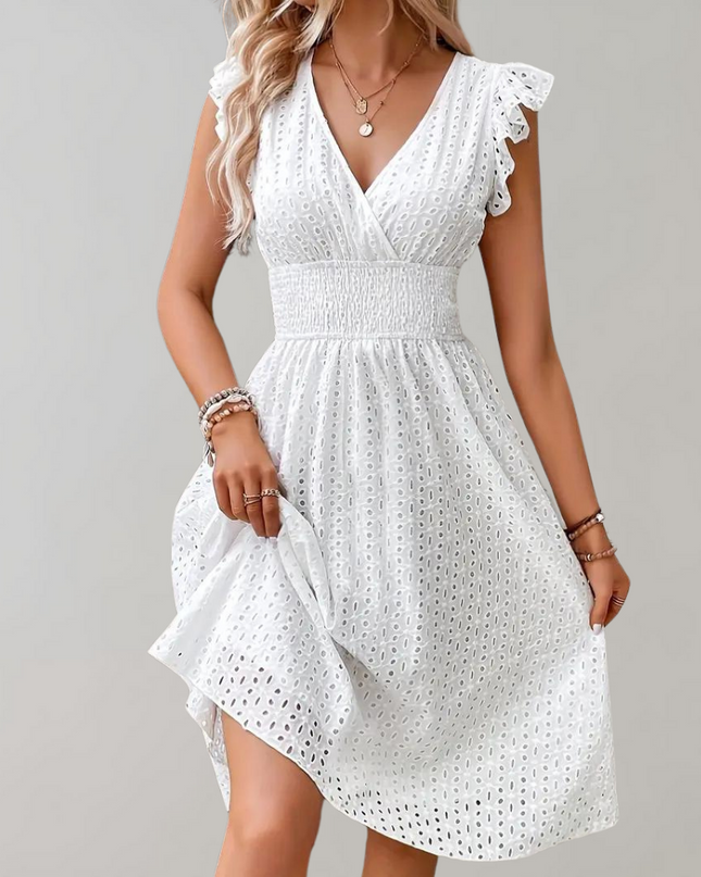 Woman wearing broderie v-neck summer dress