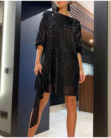 Woman wearing sparkling sequin mini dress with waist tie detail