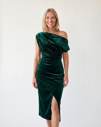 Woman wearing one-shoulder midi dress with luxe velvet finish