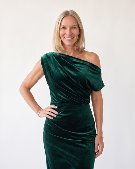 Woman wearing one-shoulder midi dress with luxe velvet finish