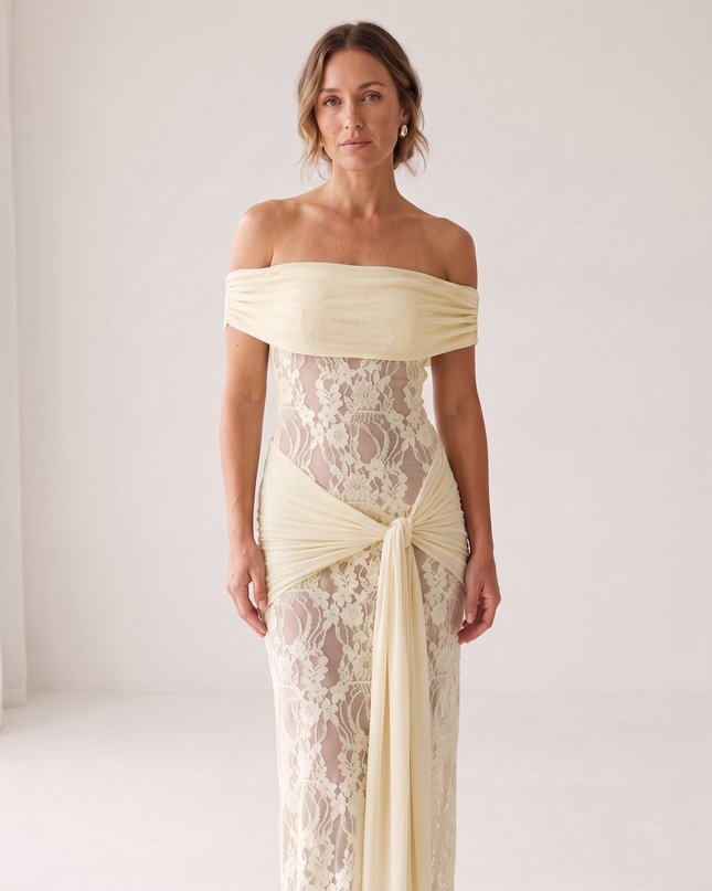 Woman wearing off-shoulder lace maxi dress