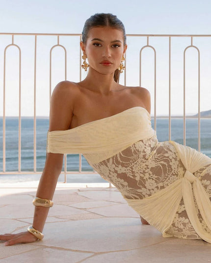 Woman wearing off-shoulder lace maxi dress