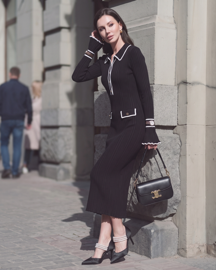 Woman wearing elegant ribbed maxi dress with timeless luxury