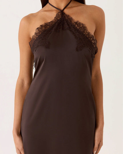 Woman wearing lace halter maxi dress