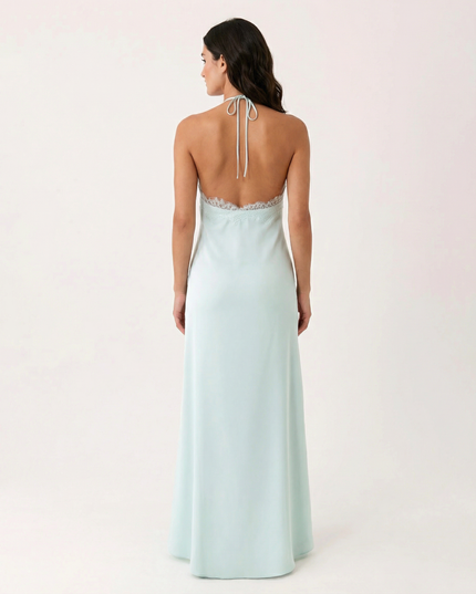 Woman wearing lace halter maxi dress