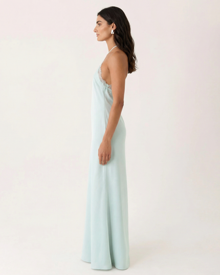 Woman wearing lace halter maxi dress