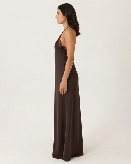 Woman wearing lace halter maxi dress