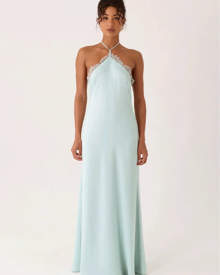 Woman wearing lace halter maxi dress