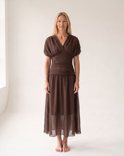 Woman wearing off shoulder maxi dress