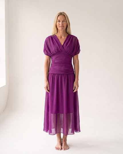 Woman wearing off shoulder maxi dress