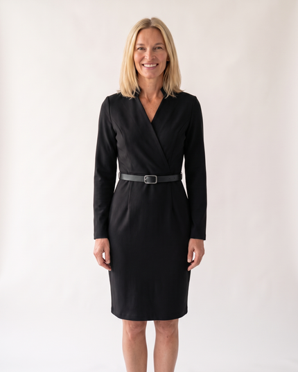 Woman wearing elegant belted midi dress