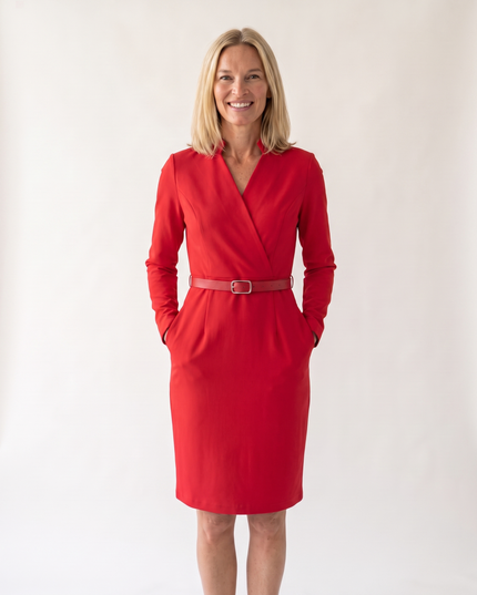 Woman wearing elegant belted midi dress