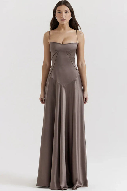 Woman wearing elegant satin maxi dress