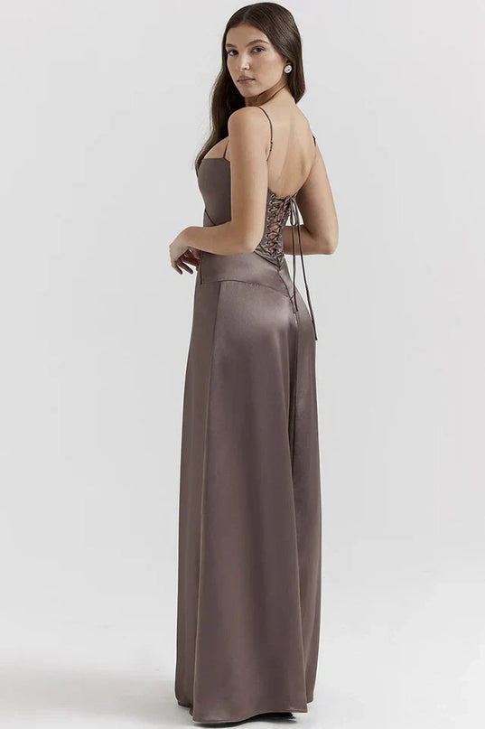 Woman wearing elegant satin maxi dress