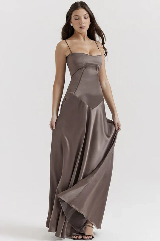 Woman wearing elegant satin maxi dress
