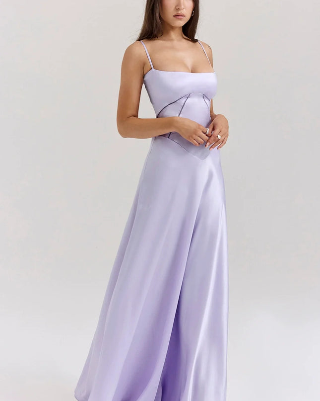 Woman wearing elegant satin maxi dress