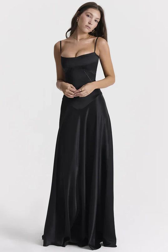 Woman wearing elegant satin maxi dress