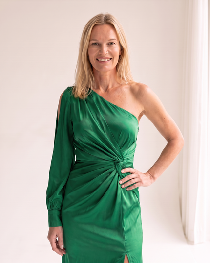 Woman wearing one shoulder satin evening dress