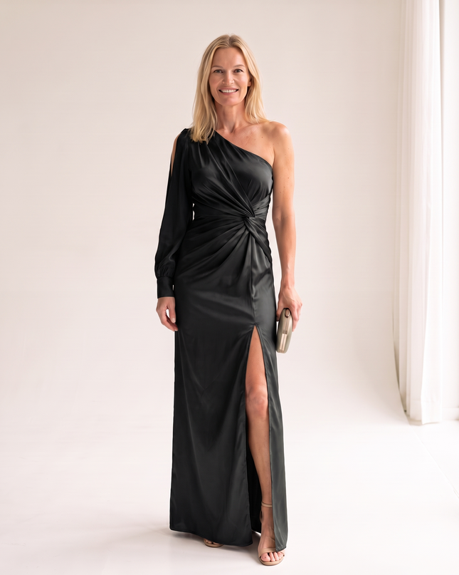 Woman wearing one shoulder satin evening dress