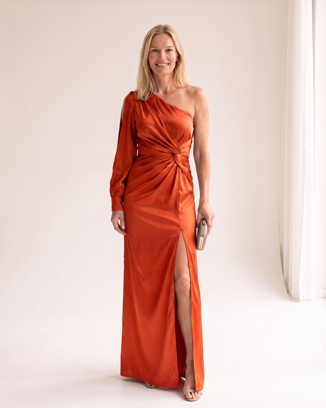 Woman wearing one shoulder satin evening dress