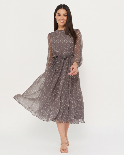 Woman wearing polka dot midi dress
