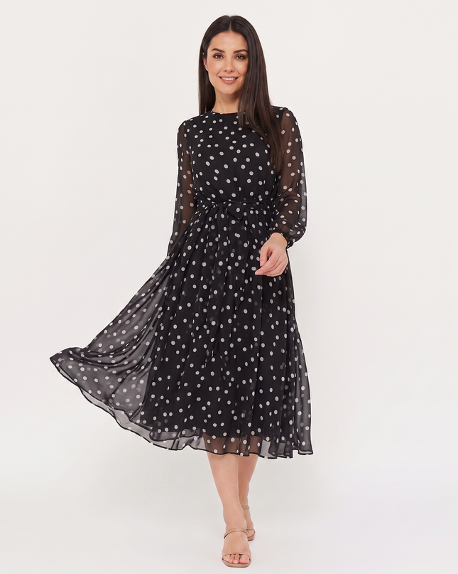 Woman wearing polka dot midi dress