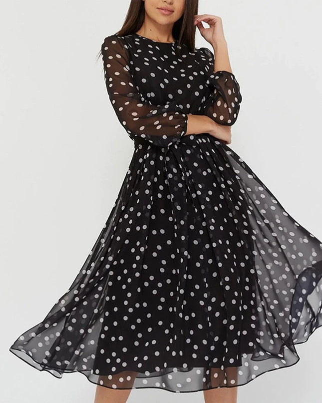 Woman wearing polka dot midi dress