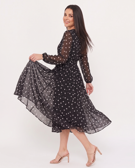 Woman wearing polka dot midi dress