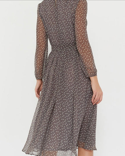 Woman wearing polka dot midi dress