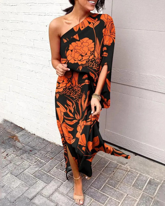 Woman wearing one-shoulder floral maxi dress with flowing silhouette