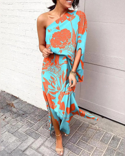 Woman wearing one-shoulder floral maxi dress with flowing silhouette