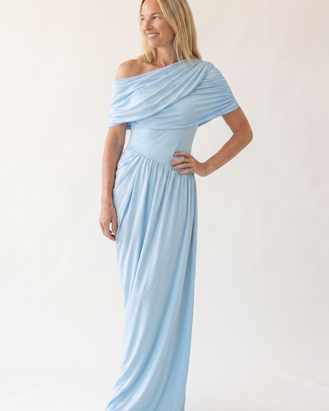 Woman wearing off shoulder maxi evening dress