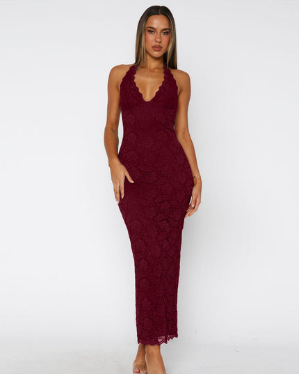 Woman wearing black lace halter backless maxi dress