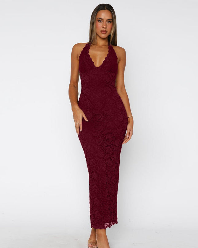 Woman wearing black lace halter backless maxi dress