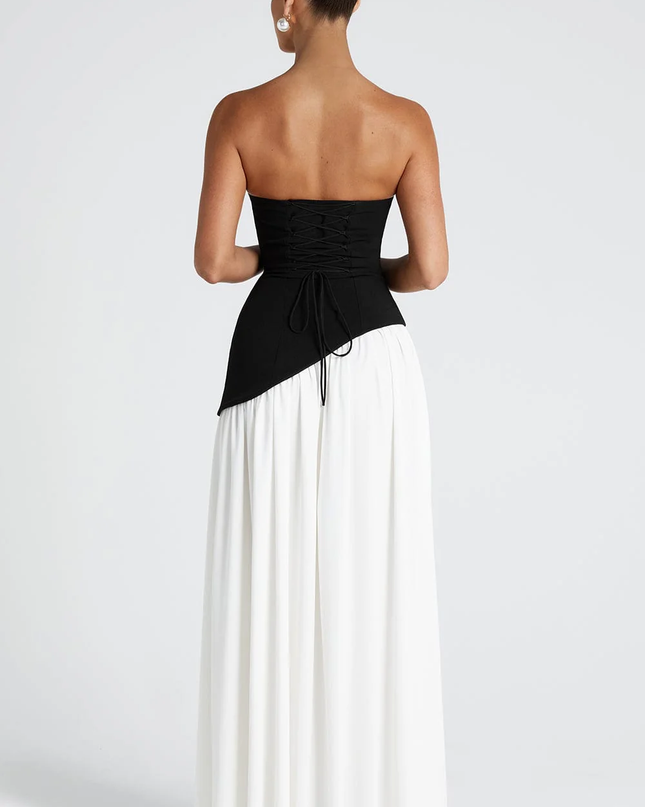 Woman wearing strapless split evening maxi dress