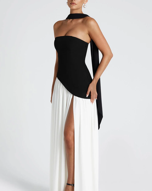 Woman wearing strapless split evening maxi dress