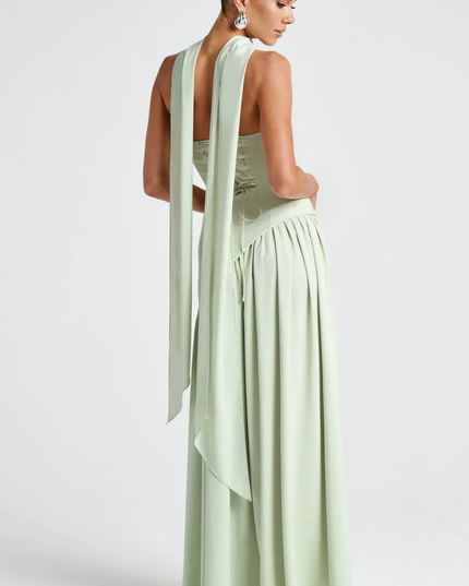 Woman wearing strapless split evening maxi dress