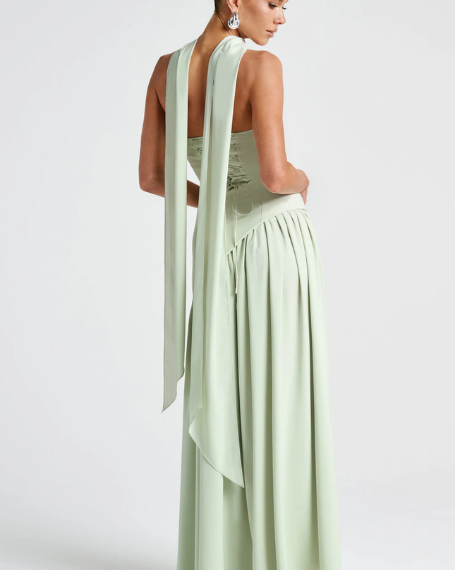 Woman wearing strapless split evening maxi dress