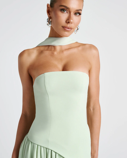 Woman wearing strapless split evening maxi dress