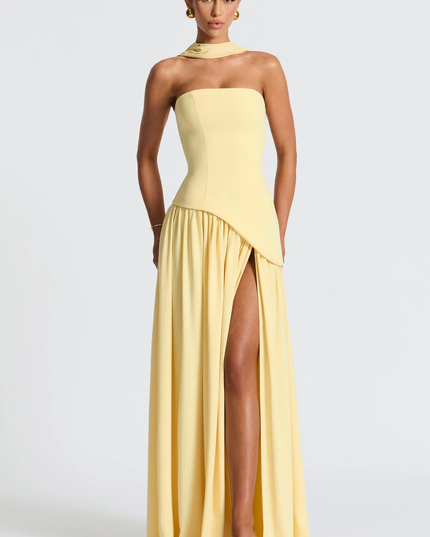 Woman wearing strapless split evening maxi dress