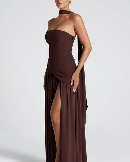 Woman wearing strapless split evening maxi dress