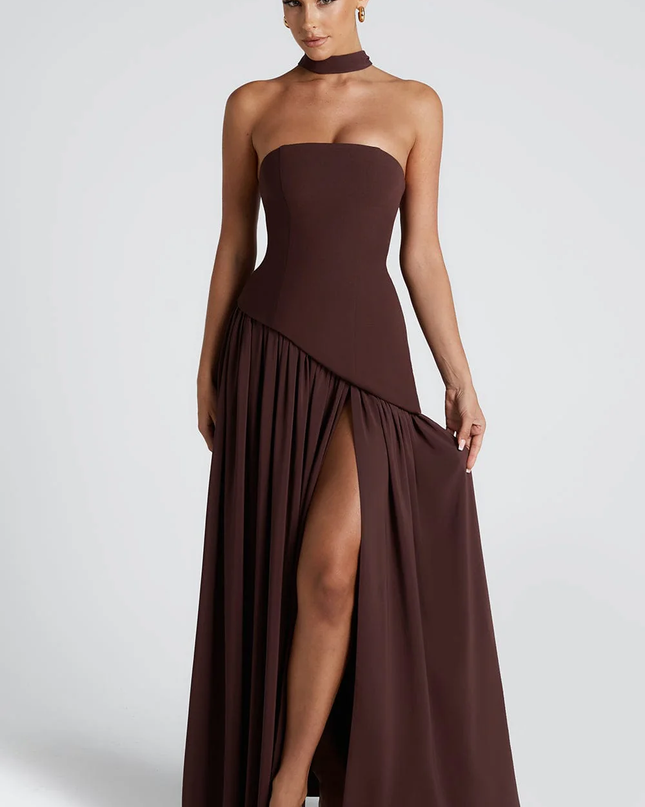 Woman wearing strapless split evening maxi dress