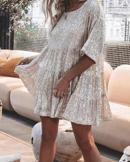 Woman wearing sequin oversized mini dress