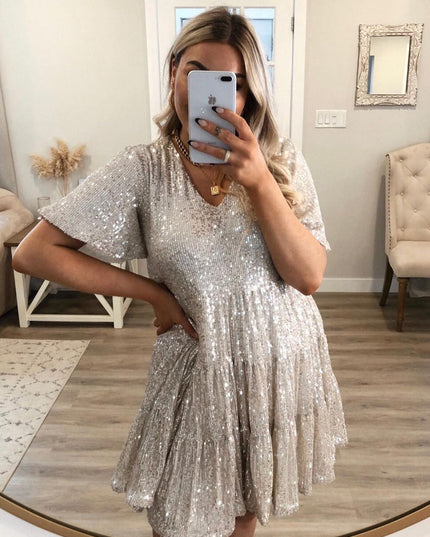 Woman wearing sequin oversized mini dress