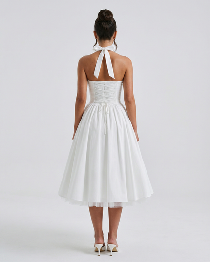 Woman wearing elegant white midi dress