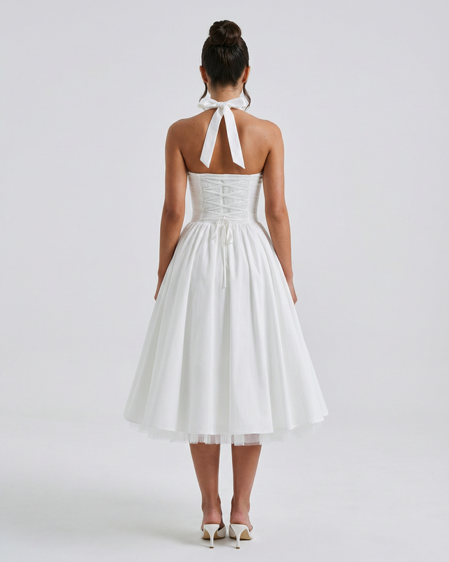 Woman wearing elegant white midi dress