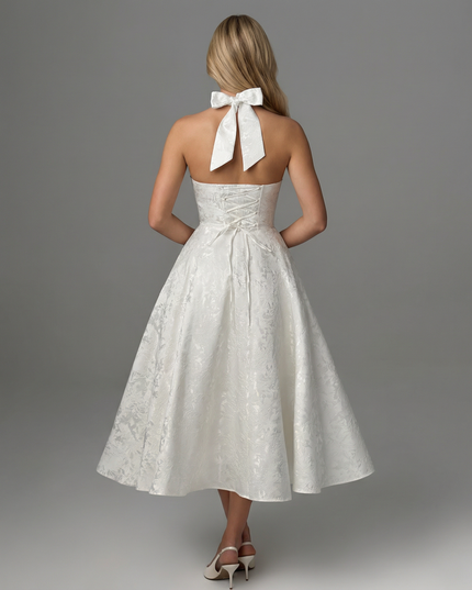 Woman wearing vintage halter midi dress